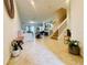 Bright living room with tiled floors, staircase, and a seamless flow into the dining area at 1509 Portofino Meadows Blvd, Orlando, FL 32824
