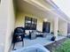 This covered patio is great for relaxing and enjoying the outdoors with comfortable seating and an inviting atmosphere at 1509 Portofino Meadows Blvd, Orlando, FL 32824