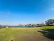 Scenic view of a serene pond surrounded by lush greenery and community homes at 1509 Portofino Meadows Blvd, Orlando, FL 32824
