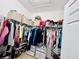 This walk-in closet is well-organized with ample shelving, hanging space, and storage drawers for maximum efficiency at 1509 Portofino Meadows Blvd, Orlando, FL 32824