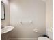Cozy half bathroom featuring white fixtures, and neutral walls at 1510 Chelsea Dr, Davenport, FL 33897
