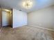 Carpeted bedroom featuring a ceiling fan and closet ideal for restful relaxation at 1510 Chelsea Dr, Davenport, FL 33897