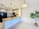 Kitchen eat-in bar with granite counters, stainless appliances, and tile floors at 1510 Chelsea Dr, Davenport, FL 33897
