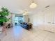 Cozy living room features ample natural light and seamless access to the outdoor living space at 1510 Chelsea Dr, Davenport, FL 33897