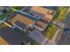 This aerial view captures a beautiful home with lush landscaping and a brick-paved driveway in a desirable neighborhood at 153 Cambridge Ave, Davenport, FL 33896