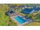 Discover the community pool, complete with a charming pavilion, sun loungers, and a refreshing escape for residents at 153 Cambridge Ave, Davenport, FL 33896