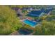 The aerial view shows the community pool with a charming pavilion and sun loungers, perfect for residents at 153 Cambridge Ave, Davenport, FL 33896