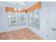 Sunlit breakfast nook with tiled floor, large windows, and a view of the front yard at 153 Cambridge Ave, Davenport, FL 33896