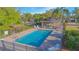 Relaxing community pool area featuring lounge chairs and beautiful landscaping, perfect for enjoying sunny days at 153 Cambridge Ave, Davenport, FL 33896