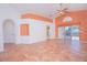 Open living room with tile floors, vaulted ceilings, and sliding glass doors to the pool at 153 Cambridge Ave, Davenport, FL 33896