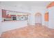 Bright living room featuring tile floors and an open view to the kitchen at 153 Cambridge Ave, Davenport, FL 33896