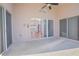Spacious covered patio offering views to the home's interior and backyard at 153 Cambridge Ave, Davenport, FL 33896