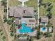 Aerial view showcasing the property's pool, patio, and lush surroundings at 16694 Olive Hill Dr, Winter Garden, FL 34787