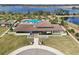 Stunning aerial view of a luxurious home with a pool, lush landscaping, and beautiful architectural details at 16694 Olive Hill Dr, Winter Garden, FL 34787