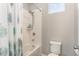 Clean bathroom with a shower-tub combo, tile surround, and neutral color scheme at 16694 Olive Hill Dr, Winter Garden, FL 34787