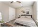 Comfortable bedroom boasts neutral tones, stylish wall decor and durable laminate flooring at 16694 Olive Hill Dr, Winter Garden, FL 34787