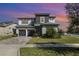 Beautiful two-story home with well-maintained lawn and two car garage at 16694 Olive Hill Dr, Winter Garden, FL 34787