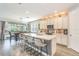 Bright, modern kitchen with a large center island and stainless steel appliances at 16694 Olive Hill Dr, Winter Garden, FL 34787