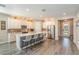 Well-lit, modern kitchen with a large center island and sleek countertops at 16694 Olive Hill Dr, Winter Garden, FL 34787