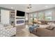Comfortable living room with stylish fireplace and hardwood floors at 16694 Olive Hill Dr, Winter Garden, FL 34787