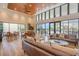 Inviting lounge area with comfortable seating, tables, and large windows providing plenty of natural light at 16694 Olive Hill Dr, Winter Garden, FL 34787