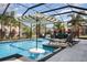 Backyard pool with screened enclosure, lounge chairs, and a striped umbrella at 16694 Olive Hill Dr, Winter Garden, FL 34787