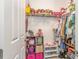 Bright walk-in closet with organized storage solutions for clothing and accessories at 16694 Olive Hill Dr, Winter Garden, FL 34787