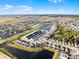 Aerial view of the community showcasing the attractive homes, landscaping and community lake at 1800 Tropical Palms Cir, Kissimmee, FL 34747