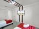 This bedroom includes two beds, a closet, and a wall-mounted TV at 1800 Tropical Palms Cir, Kissimmee, FL 34747