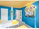 Bright bedroom featuring Minions decorations and a wall-mounted TV at 1800 Tropical Palms Cir, Kissimmee, FL 34747