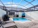 Private screened-in pool area with lounge chairs, perfect for relaxing outdoors at 1800 Tropical Palms Cir, Kissimmee, FL 34747
