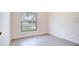 Cozy bedroom with a bright window offering natural light and a view of the outdoors at 2033 10Th Ave, Deland, FL 32724