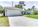 Lovely single-story home showing the driveway and attached two-car garage at 2033 10Th Ave, Deland, FL 32724