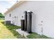 Exterior of a house showing the A/C unit and the water filtration system at 2033 10Th Ave, Deland, FL 32724