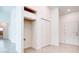 Well-lit hallway featuring a spacious closet and convenient access to other rooms at 2033 10Th Ave, Deland, FL 32724
