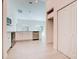 The kitchen features stainless steel appliances, white cabinets, and hard flooring at 2033 10Th Ave, Deland, FL 32724