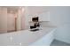 A lovely kitchen area with stainless steel appliances, white cabinets, and a breakfast bar at 2033 10Th Ave, Deland, FL 32724