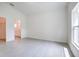 Spacious Primary bedroom with tile floors, ensuite bathroom, and walk-in closet access at 2033 10Th Ave, Deland, FL 32724