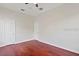 Bedroom featuring chair rail, ceiling fan, and hardwood floors at 2250 Windcrest Lake Cir, Orlando, FL 32824