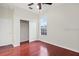 Sun-lit bedroom with hardwood floors, closet, and bright window at 2250 Windcrest Lake Cir, Orlando, FL 32824