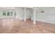 Elegant living room with tile flooring, pillars, a staircase, and lots of windows at 2250 Windcrest Lake Cir, Orlando, FL 32824