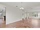 Open concept living room featuring tile floors, archways, and natural light at 2250 Windcrest Lake Cir, Orlando, FL 32824