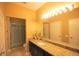 Bathroom featuring vanity with granite countertop, shower with curtain and neutral wall color at 2305 Silver Palm Dr # 102, Kissimmee, FL 34747