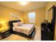 Comfortable bedroom with a queen bed and large window, providing lots of natural light at 2305 Silver Palm Dr # 102, Kissimmee, FL 34747