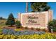 Windsor Palms, a gated resort community, sign with colorful flowers in the landscaped entrance at 2305 Silver Palm Dr # 102, Kissimmee, FL 34747