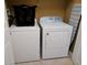 Convenient laundry room with washer and dryer, and ironing board at 2305 Silver Palm Dr # 102, Kissimmee, FL 34747