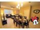 Cozy living and dining area perfect for entertaining, filled with natural light at 2305 Silver Palm Dr # 102, Kissimmee, FL 34747