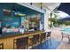 Poolside tiki bar with seating and resort style ammenities at 2305 Silver Palm Dr # 102, Kissimmee, FL 34747