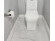 Clean bathroom featuring white toilet, tiled floors, and gray walls at 231 Old Mill Cir, Kissimmee, FL 34746
