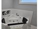 Relaxing bathroom with a large jetted tub, complete with a handheld shower, for a spa-like experience at 231 Old Mill Cir, Kissimmee, FL 34746